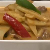 Red Curry · Bamboo shoots, eggplant, bell peppers, and basil leaves simmered in red curry sauce with coc...