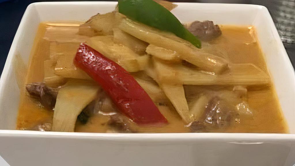Red Curry · Bamboo shoots, eggplant, bell peppers, and basil leaves simmered in red curry sauce with coconut milk.