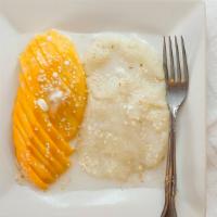 Mango & Sweet Sticky Rice · Sweet ripe mango over warm sticky rice lathered in a creamy and sweet coconut milk.