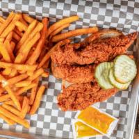 Tender Trio · Three juicy tenders spiced up on country white bread topped with kosher dill pickles. Comes ...