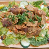 Lamb & Beef Gyro Salad · Includes romaine lettuce onion tomatoes cucumber feta cheese and olives.