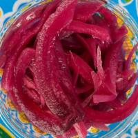 Pickled Red Onions · House made pickled red onions. Perfect tangy side for your spread!.