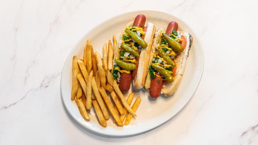 Rizzo’S Chicago Dog · Vienna beef hot dog, mustard, green relish, pickle, onion, tomato, sport peppers and celery salt.