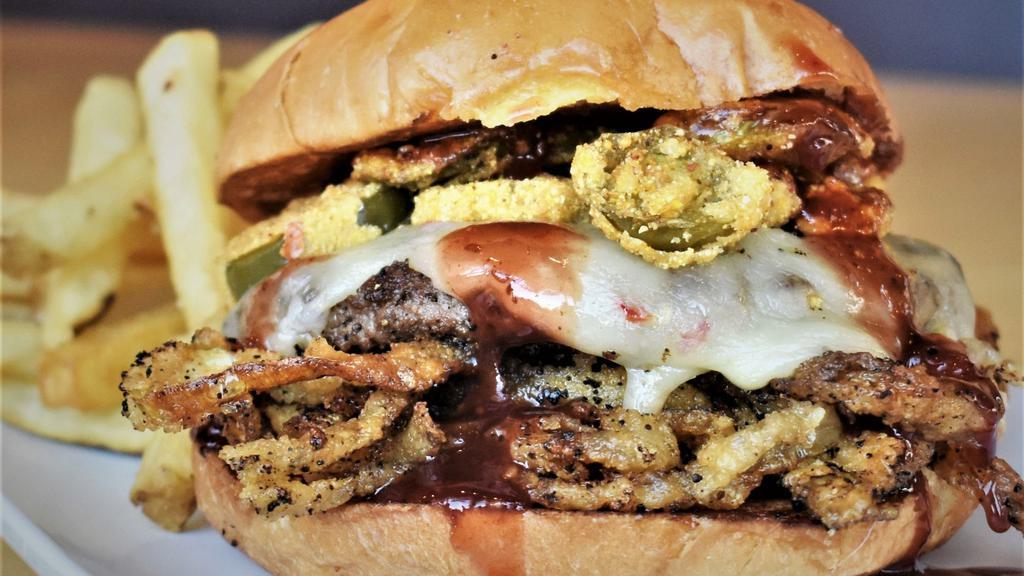 Campfire · Buffalo patty, raspberry BBQ, pepper jack, jalapeño bottle caps, coffee-dusted onion strings. Served with your choice of side.