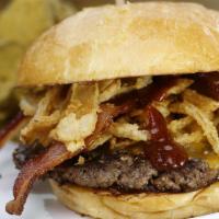 Krusty · Peppercorn-crusted, BBQ sauce, bacon, cheddar, onion strings, ketchup. Served with your choi...