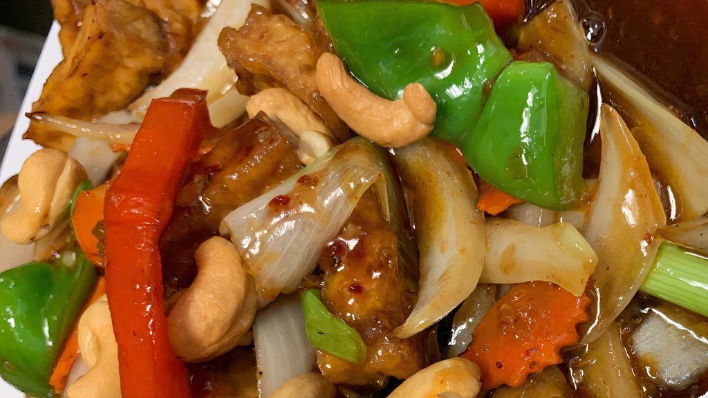 Cashew Nut Stir Fry · A popular cashew nut stir fry with carrot, bell pepper, broccoli, onion, green onion, and cashew nut in soya bean oil sauce. served with White rice