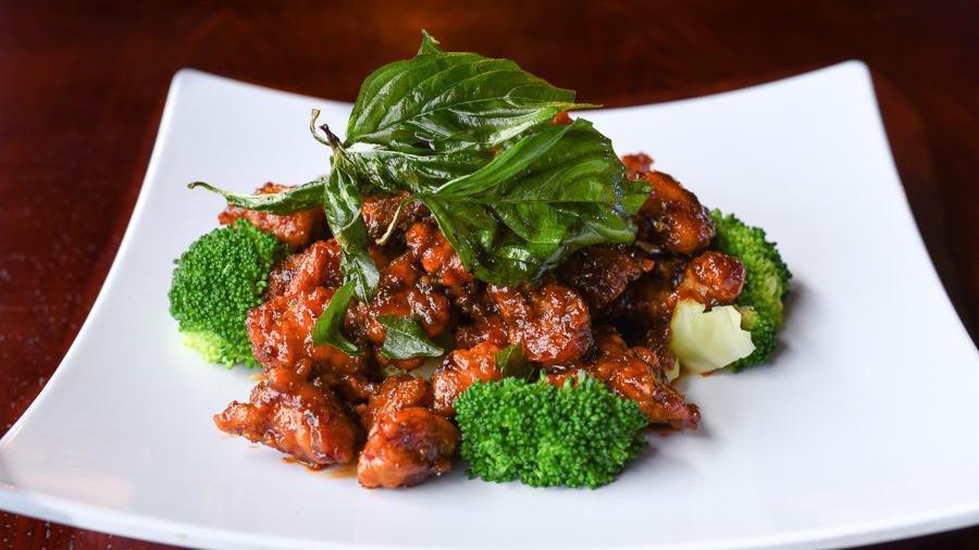 Crispy Garlic Chicken · DEEP FRIED CHICKEN BREAST SAUTEED IN OUR SPECIAL HOMEMADE SAUCE.TOPPED WITH CRISPY BASIL.