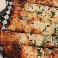 Mother Of All Cheesy Bread · Garlicky butter, brick and smoked white cheddar cheeses, parmesan. Served with crazy sauce a...