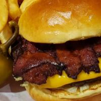 Bacon Cheeseburger · 1/4 pound burger served with our custom weave of bacon slices and American cheese. Garnished...