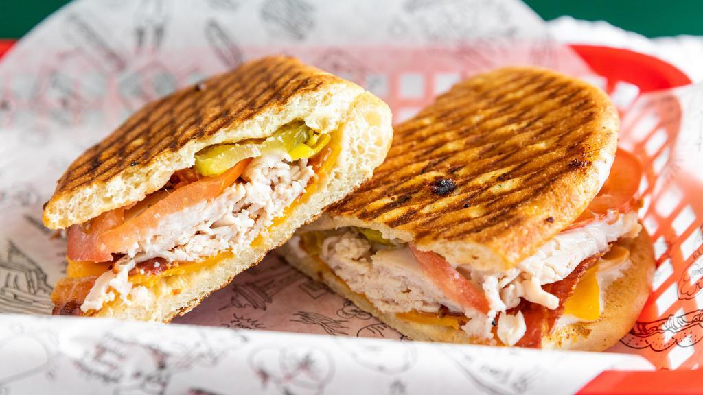 Turkey Bacon Ranch · Turkey, bacon, cheddar cheese, tomato, pickles, pepperoncini & ranch dressing.