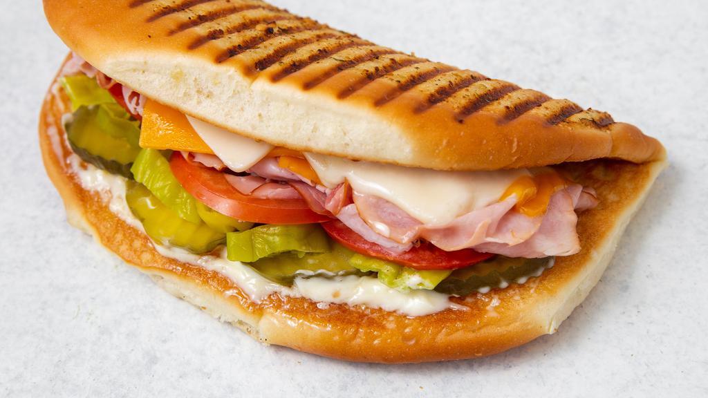 Americano · Your choice of meat, cheddar & Swiss, tomato, pickles, pepperoncini & mayonnaise.