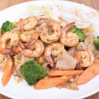 Pad See Ew · Wide rice noodles stir-fried with broccoli, carrot, and egg with sweet soy sauce top with be...