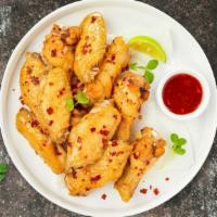 Vegan Sweet Chili Billy Wings · Vegan chicken wings breaded, fried until golden brown, and tossed in sweet chili sauce. Serv...