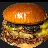 Smashed Truffle Burger · Fresh black winter truffles shaved on top of two seasoned plant-based patties with grilled o...