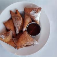 Sopapilla Basket · Fried pastry coated with cinnamon and sugar and served with a honey dipping sauce.