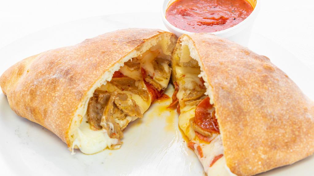 Stromboli · Stuffed with mozzarella and your choice of two additional items. Served with a side of tomato sauce.