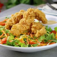 Chicken Tender Salad · Chicken tenders on fresh salad greens with cheese, tomatoes, carrots, and honey mustard dres...