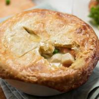 Homemade Chicken Pot Pie · Chicken and vegetables in a savory sauce, topped with a flaky crust, served with a fresh hou...