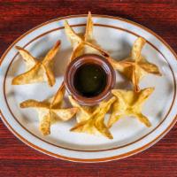 Crispy Parcel (6) · Deep fried wonton wraps, stuffed with cream cheese, cilantro, crab; served with plum sauce.