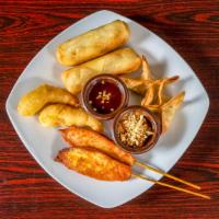 Combo Appetizer · Combination of chicken satay (2), crispy parcel (2), spring rolls (2) and fried shrimp (2).
