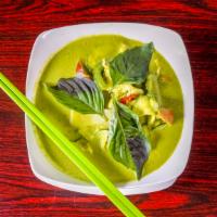 Green Curry · Green curry paste with coconut milk, Thai eggplant, zucchini, carrot, bell pepper, bamboo sh...