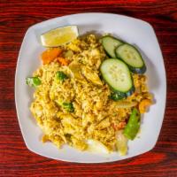 Pineapple Fried Rice (Chicken & Shrimp) · Jasmine rice with egg, pineapple, snow peas, onion, carrot, broccoli, cashew with yellow cur...