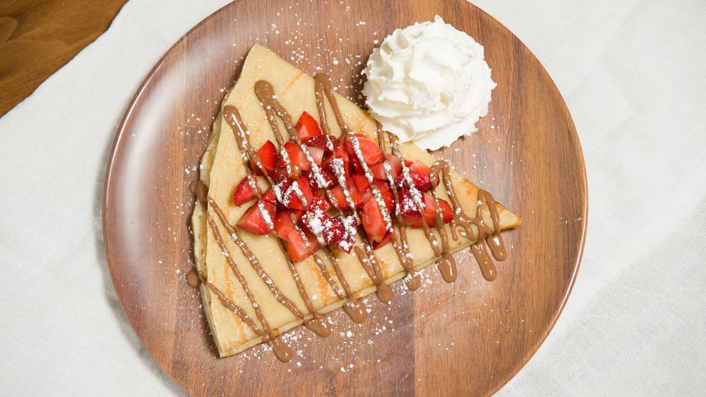 Build Your Own Crepe Or Waffle · Sweet French influenced crepe or a warm waffle. Choose from our delicious chocolates. Pick your fruit puree and add bananas or strawberries.