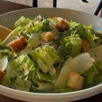 Half Caesar Salad · Romaine, house-made garlic croutons,
our signature Caesar dressing