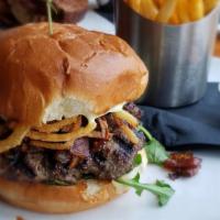 Bistro Burger · Steak burger, bacon jam,
brioche bun, tavern sauce,
arugula, crispy onions