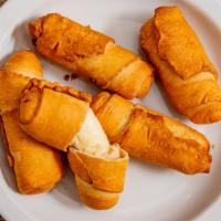 Cheese (Fried) Tequeños · Pack of 5. Pastry crust wrapped around salty queso blanco.
