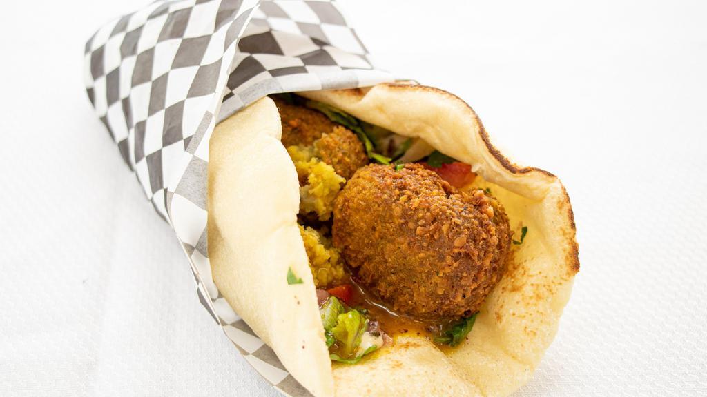 Falafal · Deep-fried ball (ground chickpeas ) onion, pars ley wrapped in pita served with salad.