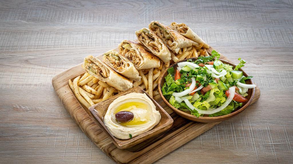 Shawarma & Fries  · Arabic style grilled sliced marinated meat, served with salad, french fries, and garlic sauce.