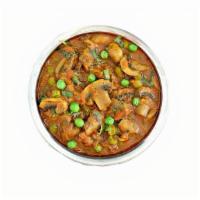 Mushroom Matar · Vegan. Fresh sliced mushrooms and peas sauteed with ginger and spices.