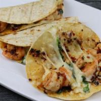 Tacos Enchilados · Tres tacos de camarón picoso, con queso, cebolla, cilantro, crema y chile. 
Order of three s...