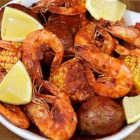 Camarones Louisiana · Camarón entero, elote y papas bañados en salsa especial Louisiana.
Head on shrimp, corn and ...