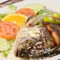 Mojarra Frita · Jugosa mojarra frita, con arroz, frijol y ensalada al lado. / Juicy fried mojarra, with rice...