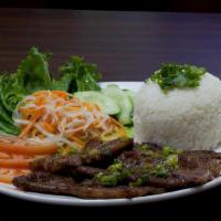 Char-Grilled Marinated Beef / Cơm Sườn Bò Nướng · Served with steamed rice.