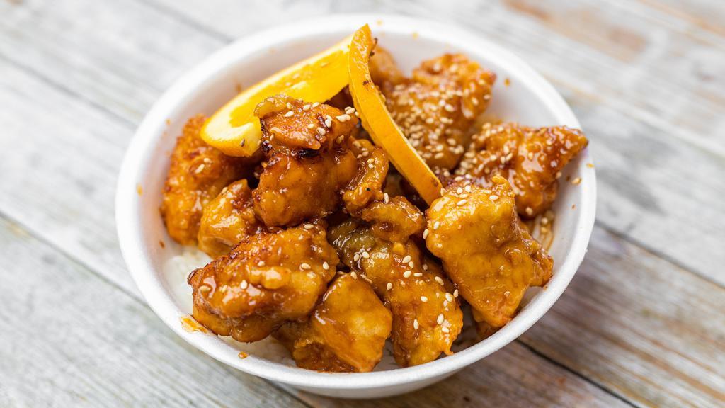 Orange Chicken Bowl · breaded breast chicken glazed with a sweet and tangy orange sauce over the rice