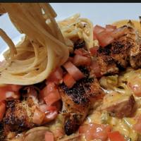 Voodoo Pasta · Diced Chicken, Shrimp and Sausage in our Voodoo Sauce over pasta