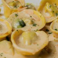 Tortelli Ai Funghi · Mushroom and Ricotta Filled Tortelli ~ Brussels Sprouts ~ Almonds ~ 
Glazed Shallot White Wi...