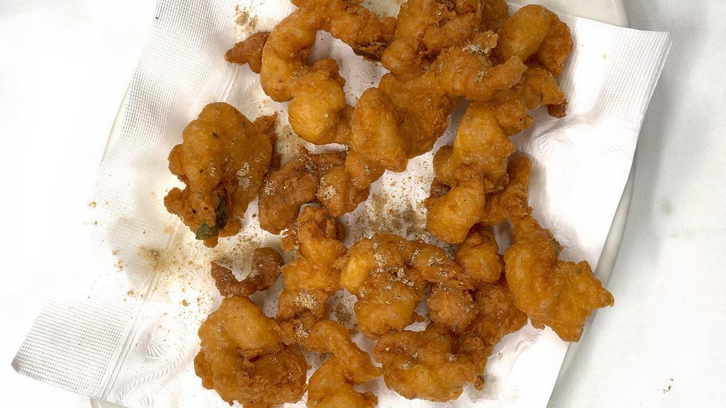 Shrimp Pakora · Piece of shrimp deep fried with gram flour. Gluten free.