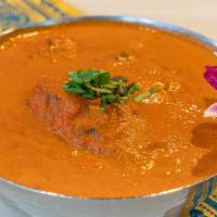 Chicken Tikka Masala · Tender pieces of chicken broiled in tandoor, cooked in masala sauce. Includes a side of whit...