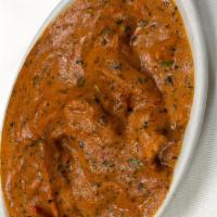 Chicken Makhani · Boneless tandoori chicken cooked in olive and in special tomato gravy.