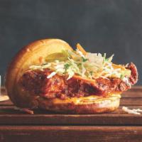 Nashville Hot Chicken Sandwich · Crispy Nashville-style hot chicken breast topped with dill pickles, creamy coleslaw and spic...