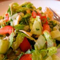 Fattoush · Mixed green salad with fried bread strips.