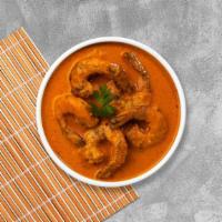 Seafood Curry · Coconut milk, red curry with a mix of seafood, bell peppers, and pineapple.