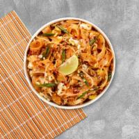 Chicken Noodles · Pan fried big rice noodles with egg, bean sprout, and onion on a bed of lettuce with ground ...