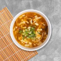 Tom Yum Soup · Exotic spices blended in lime juice with roasted chili paste, mushroom, tomatoes, jalapeno, ...