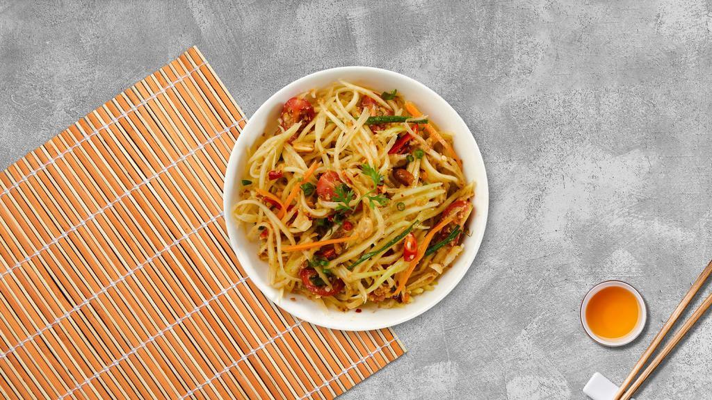 Papaya Salad · Shredded papaya, shredded carrots, tomatoes, and peanuts mixed with a sour and spicy lime dressing.