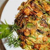 Seafood Pancake  해물파전 · Crispy pancake with scallions, onions, shrimp, 
mussels, and squid
